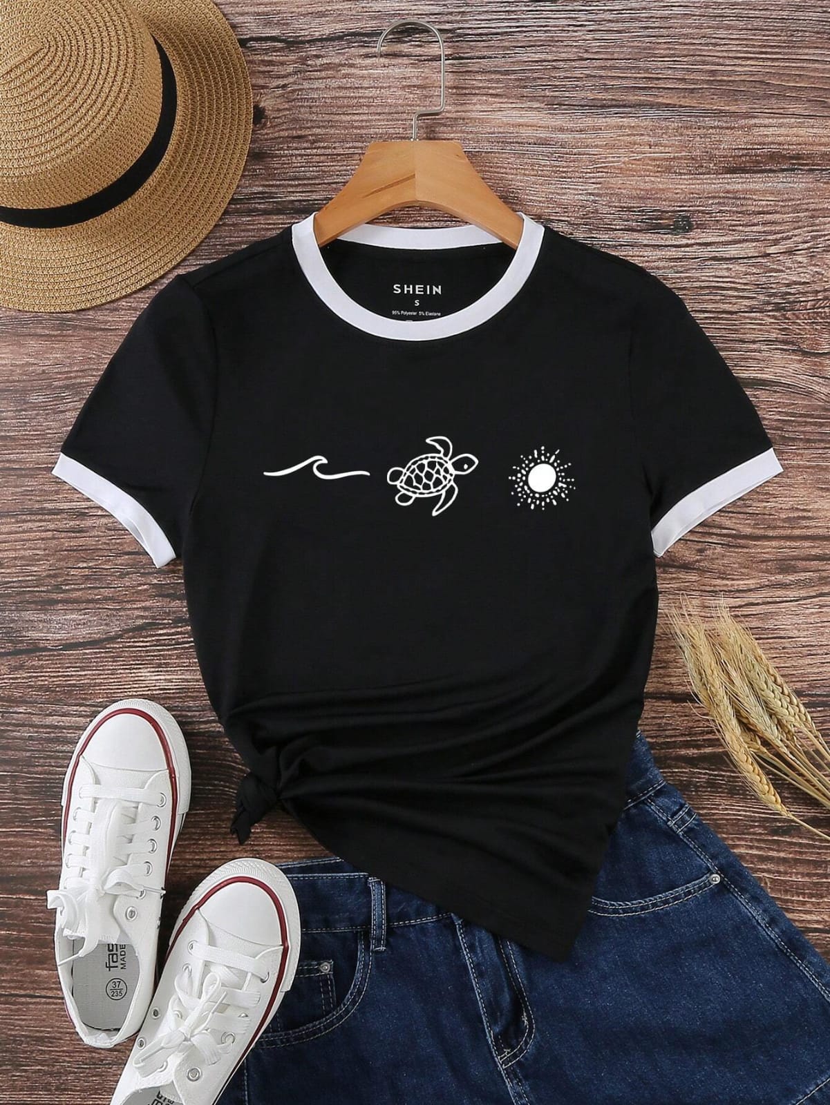 CAMISA NEGRA CON DELLATES BLANCOS