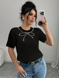 CAMISA NEGRA CON DISEÑO DE MOÑITO CON PERLAS