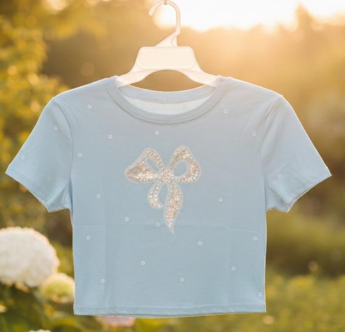 CAMISA CELESTE DE MUJER CON DIBUJO DE MOÑO Y PERLAS 0004696