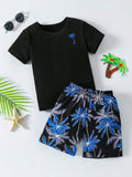 CONJUNTO NEGRO CON DISEÑO DE PALMA