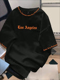 CAMISA DE LOS ANGELES LETRAS ANARANJADAS