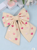 GANCHO BEIGE CON CORAZONES DE PELO