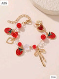 PULSERA DE FRESAS Y CORAZONES