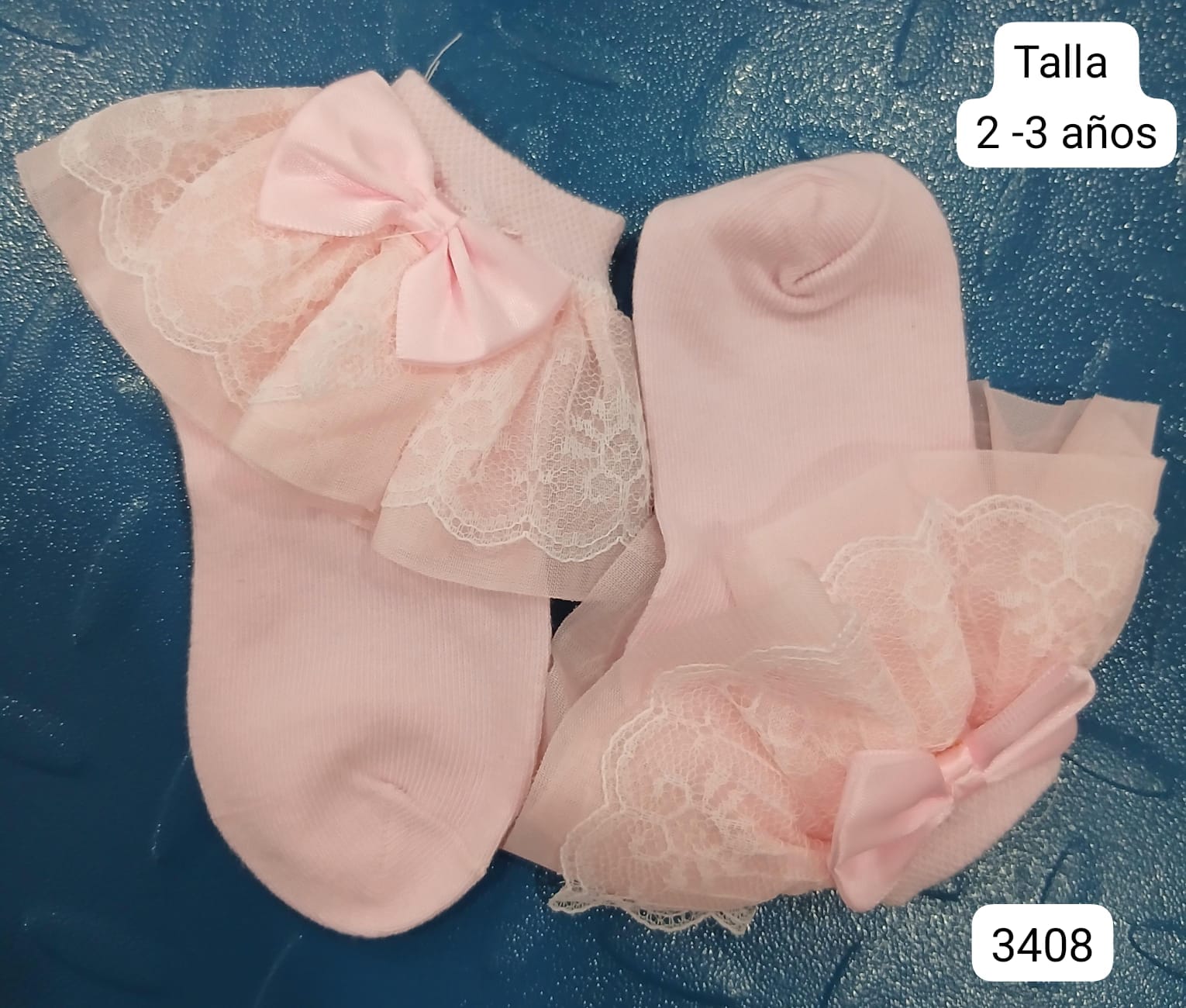 PAR DE CALCETAS ROSAS DE NIÑA