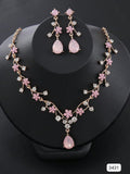COLLAR + PENDIENTES EN TONOS ROSADOS