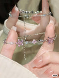 PULSERA PLATEADA CON FLORES ROSADAS