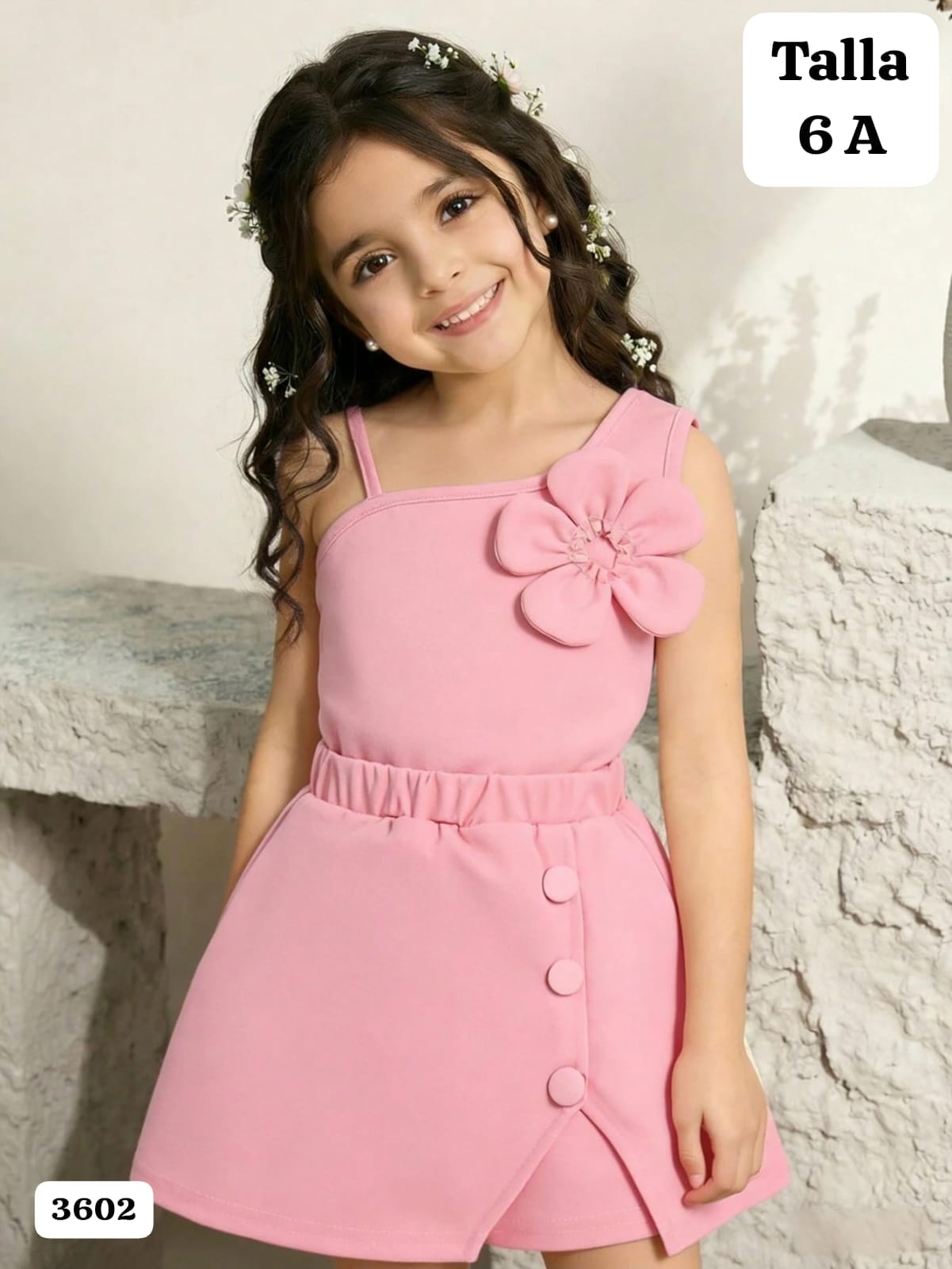 CONJUNTO ROSA DE CAMISA DE MANGA DE TIRANTES Y FALDA DE NIÑA