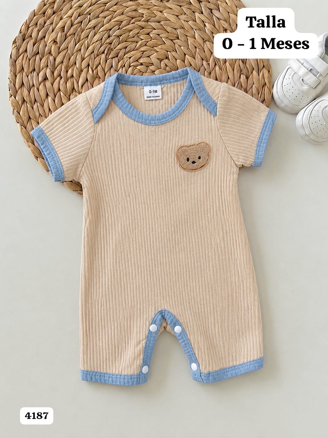 MAMELUCO BEIGE CON BORDE AZUL