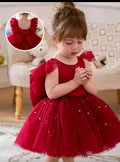 VESTIDO MORADO CON PERLAS DE NIÑA